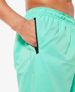 nohavice Pánske základné šortky 120 na fitnes priedušné s vreckami na zips zelené