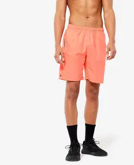 nohavice Pánske šortky 120 na fitnes priedušné s vreckami na zips oranžové
