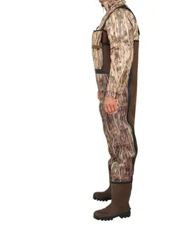 nohavice Poľovnícke brodiace neoprénové nohavice 500 hrejivé maskovanie s motívom močiara