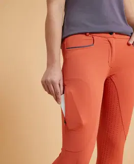nohavice Dámske jazdecké nohavice 580 Light - rajtky s celogripovým sedom oranžové