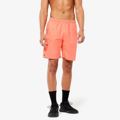 nohavice Pánske šortky 120 na fitnes priedušné s vreckami na zips oranžové