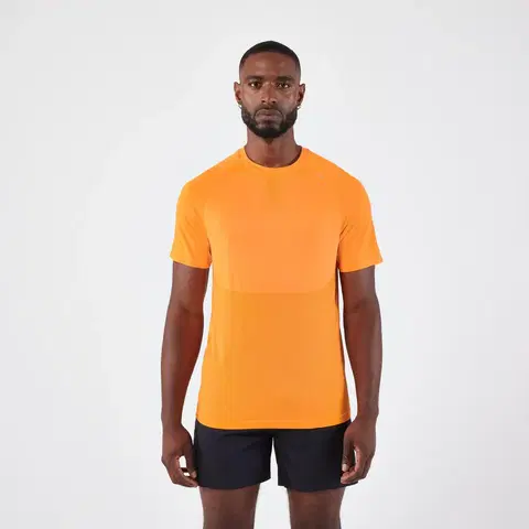 nordic walking Pánske bežecké tričko Run 500 Confort bez švov svetlooranžové